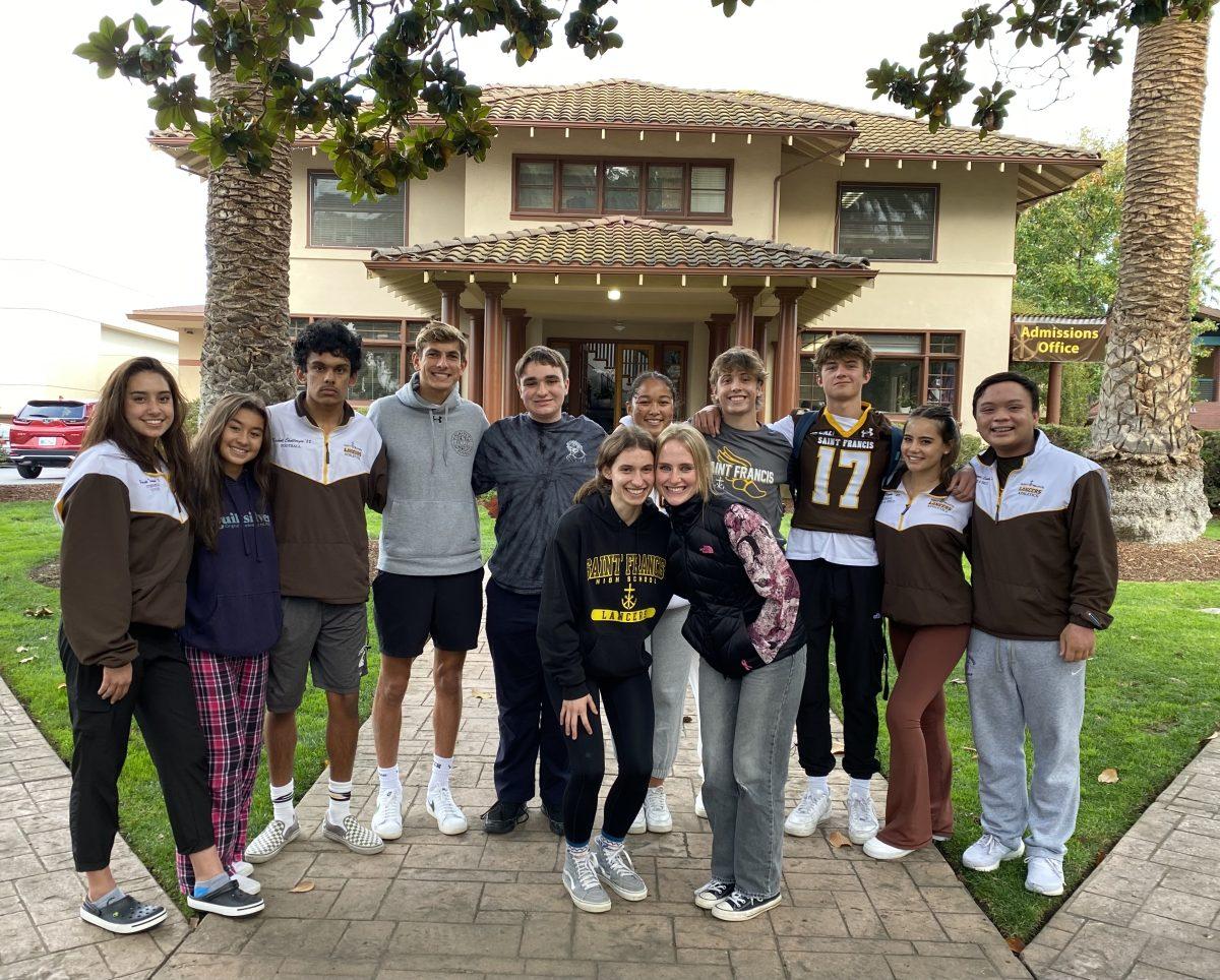 Homecoming Court in the Prayer Garden. Nominees pictured in back row (from left to right): Porsche Trinidad, Hailey Multz, Kushal Chatterjee, Brody Ghashghai, Marc Orlando, Jewel Merriman, Leo Vagnati, Joe Wallace, Ella McConnell, Aiden Sanchez. Winners pictured in front row (from left to right): Sarah Vorrath, Caroline Arangio. Photos by Ava Hennen (’22). 
