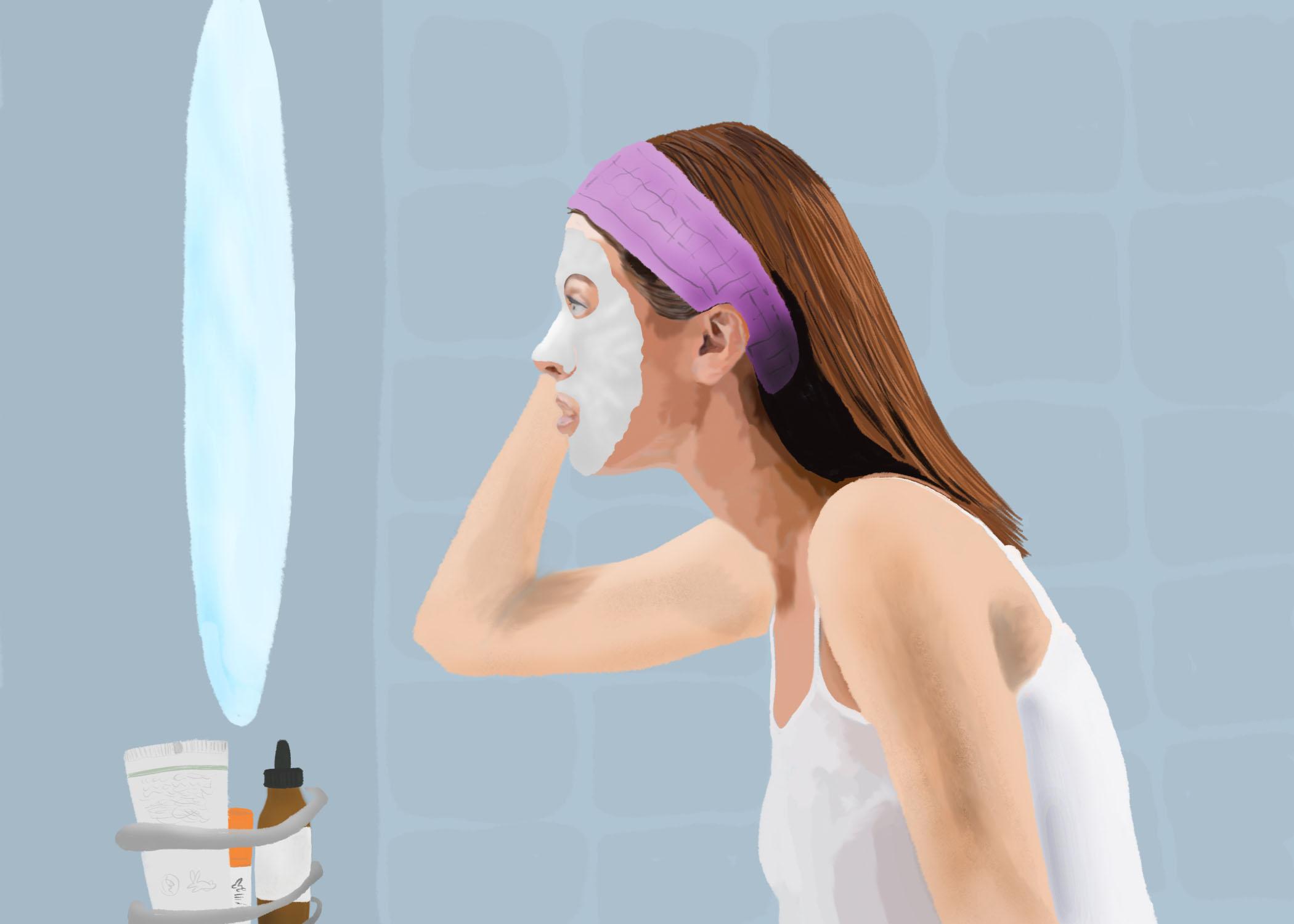 Woman meditating surrounded by self-care products