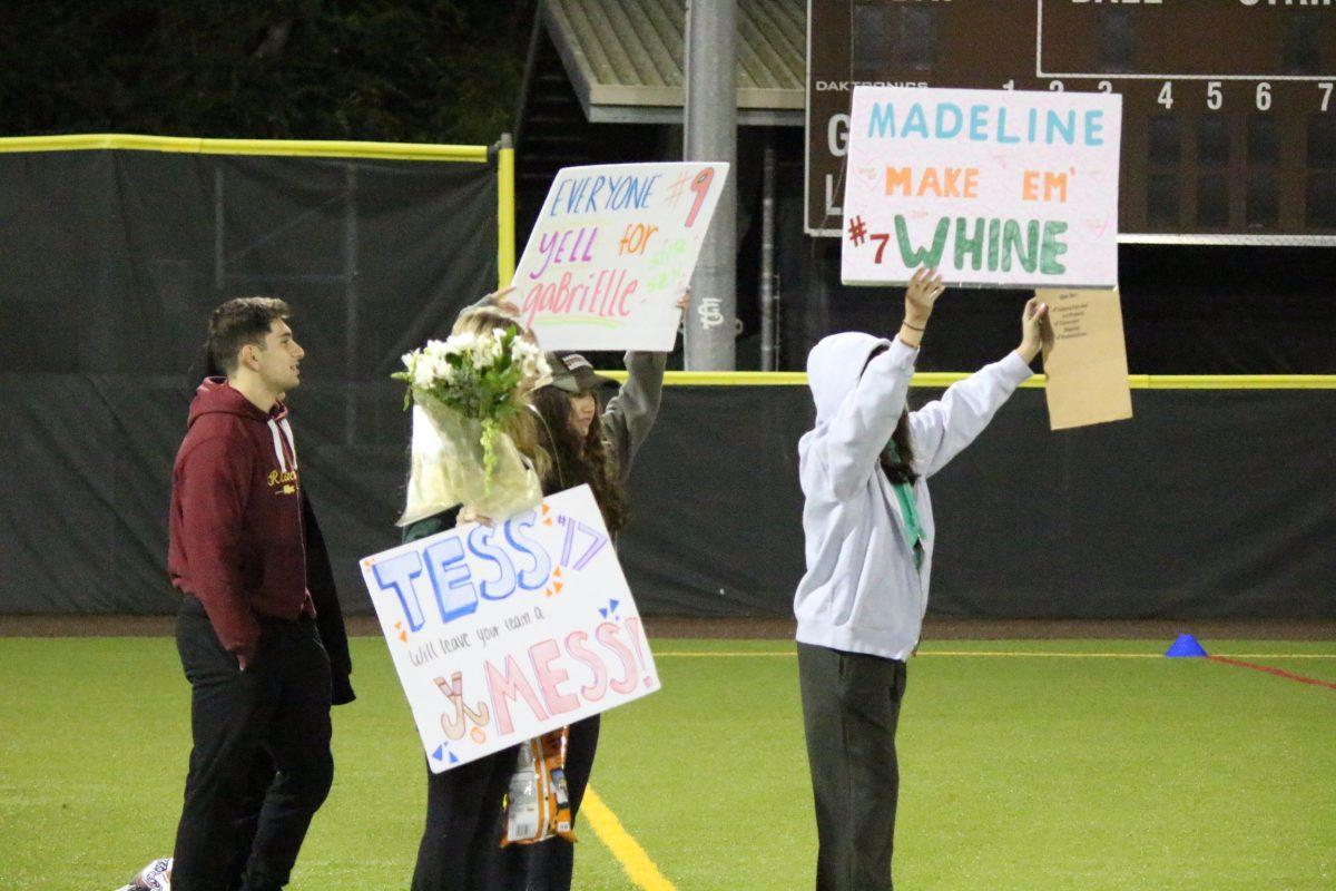 Students celebrate the win and senior night.