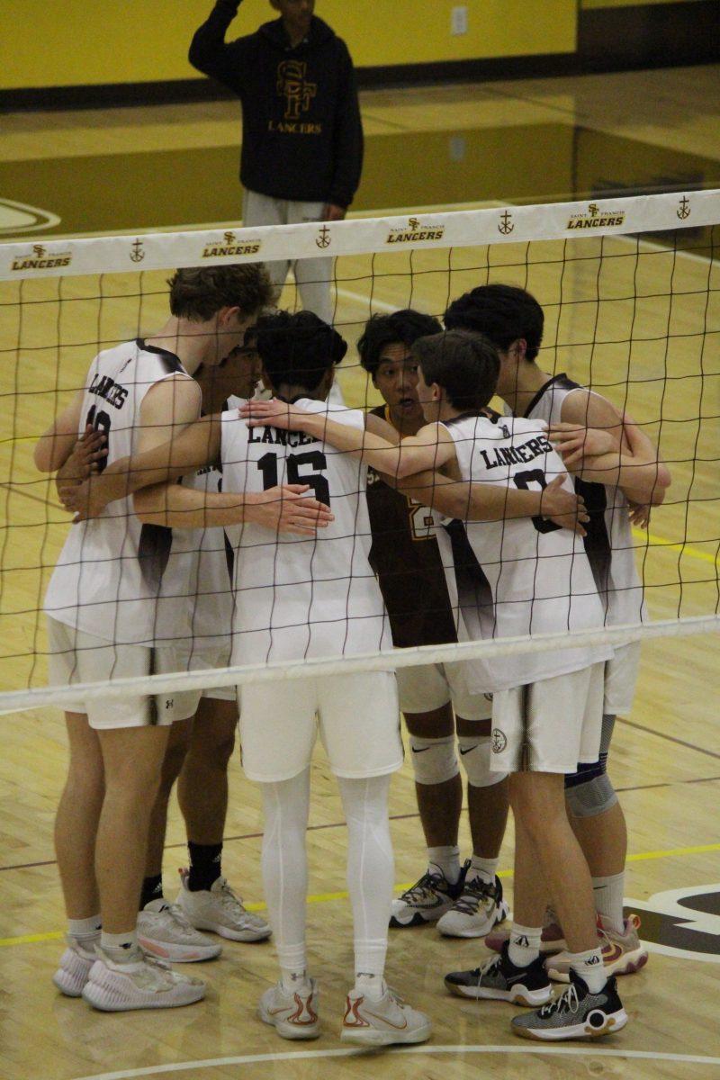 Lancers huddle up after a point.