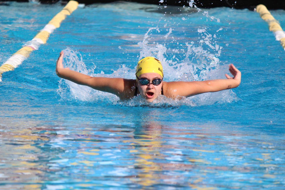 Marisa Baltodano (’25) takes a breath mid-fly.