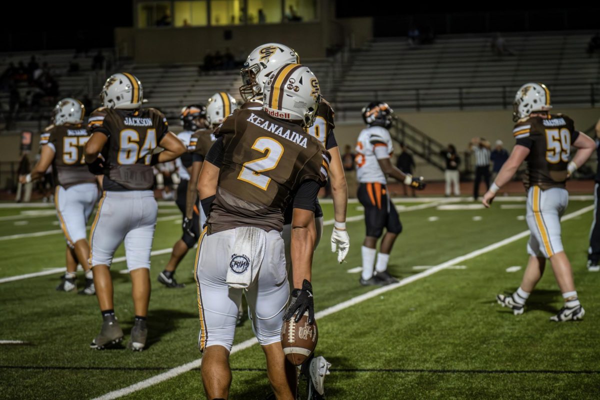 Kingston Keanaaina ('25) secures the ball after a crucial drive.