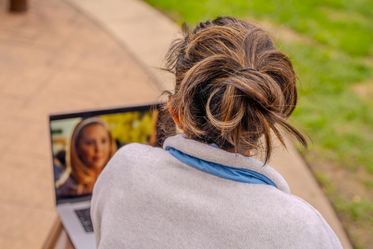 Anya Nandiwada ('25) watches Easy A after classes.