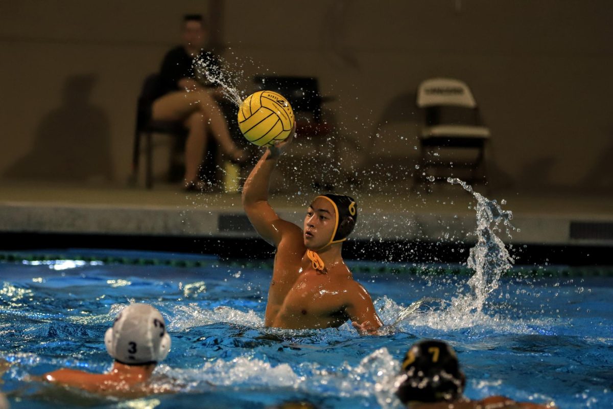 Dmitri Verstak (’25) rises out of the water to shoot the ball.