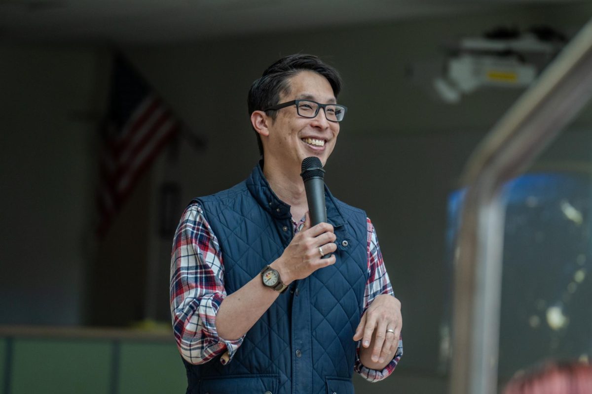 Mr. Yang smiles while listening to a Q&A question.