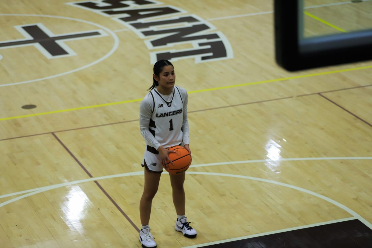 Maia Jimenez (’25) looks at the referee before shooting a free throw. 