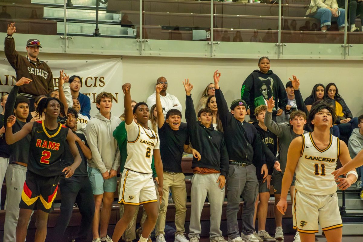 Rage Cage cheers after Robinson shoots a three-pointer.