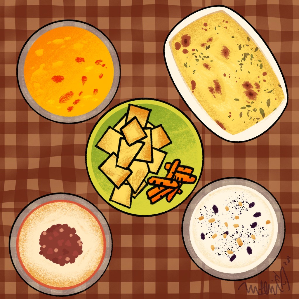 Several delicious dips and a bowl of chips on a cozy picnic blanket. 