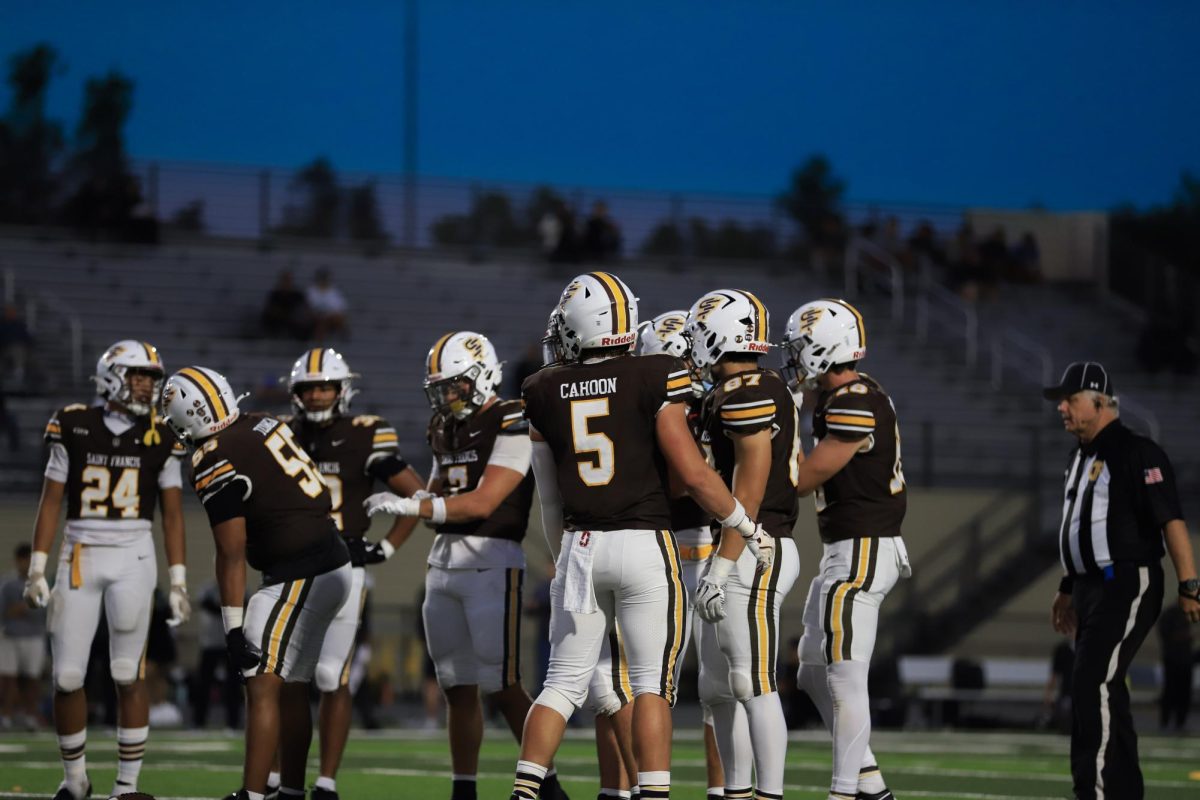 The team gets ready before the next play.