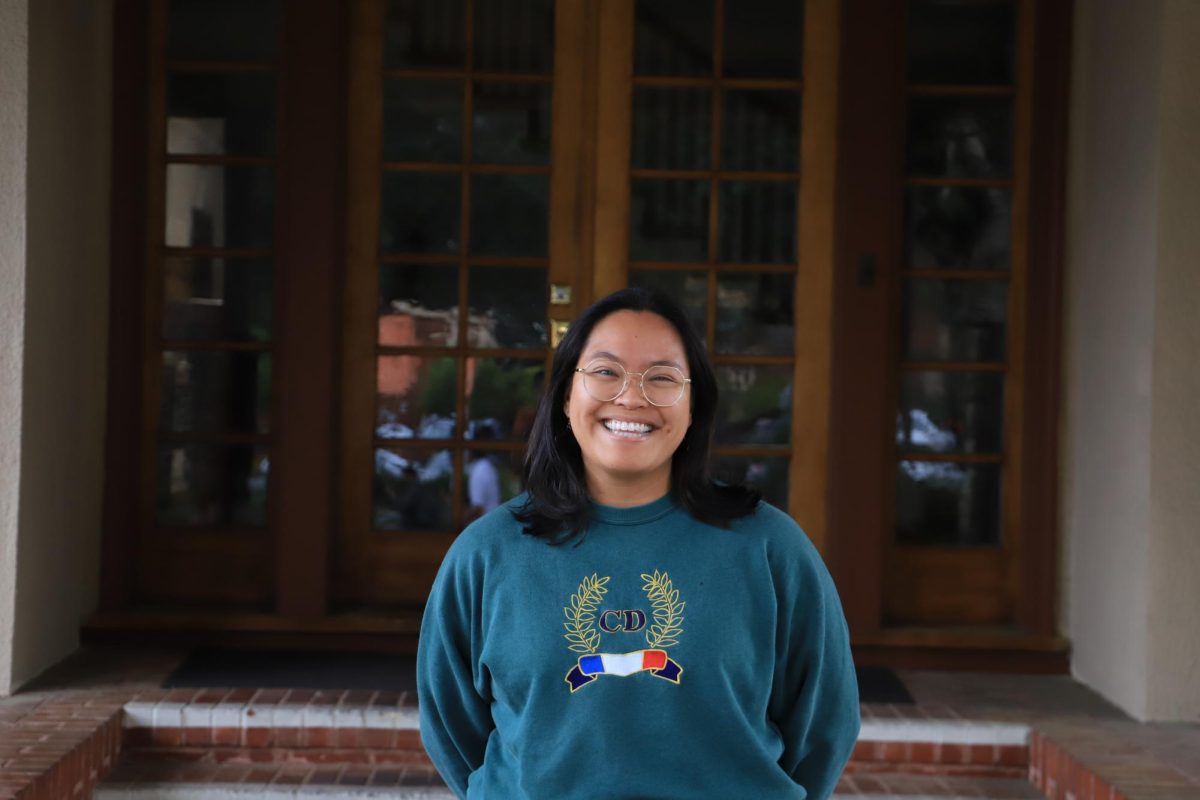 Ms. Salapare gives a cheeky smile in front of the Andre House.