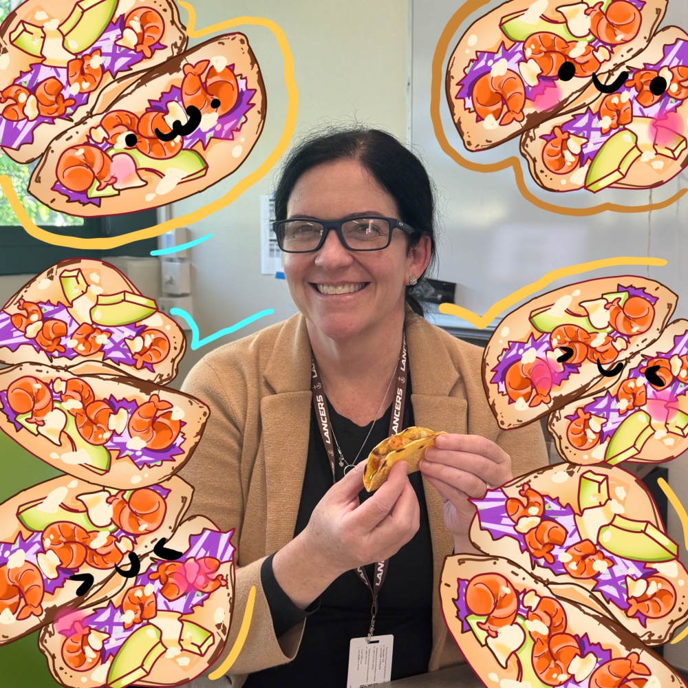 Mrs. Walsh poses with her shrimp tacos.