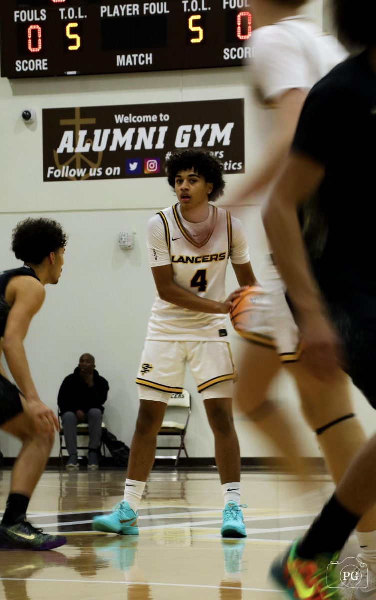 Weston Edwards ('28) looks for a teammate to pass the ball to.
