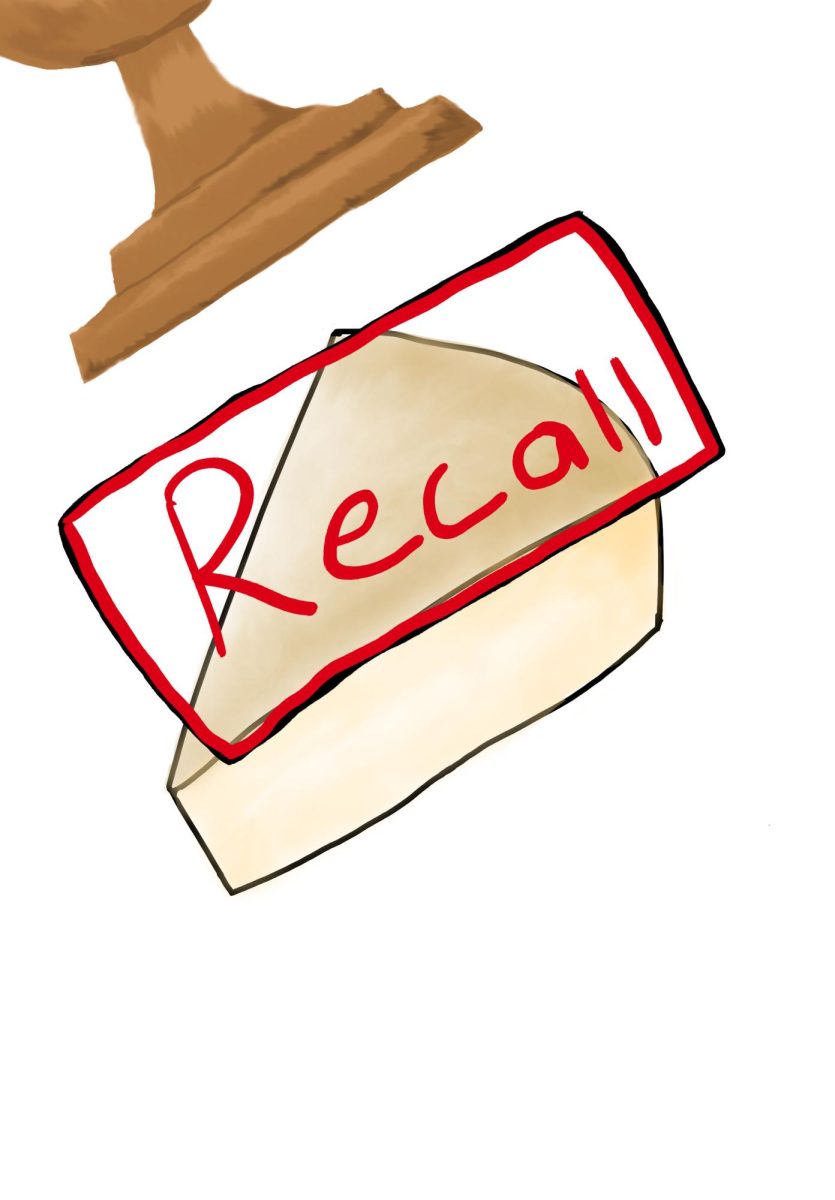 A wedge of cheese being stamped with "Recall" label.