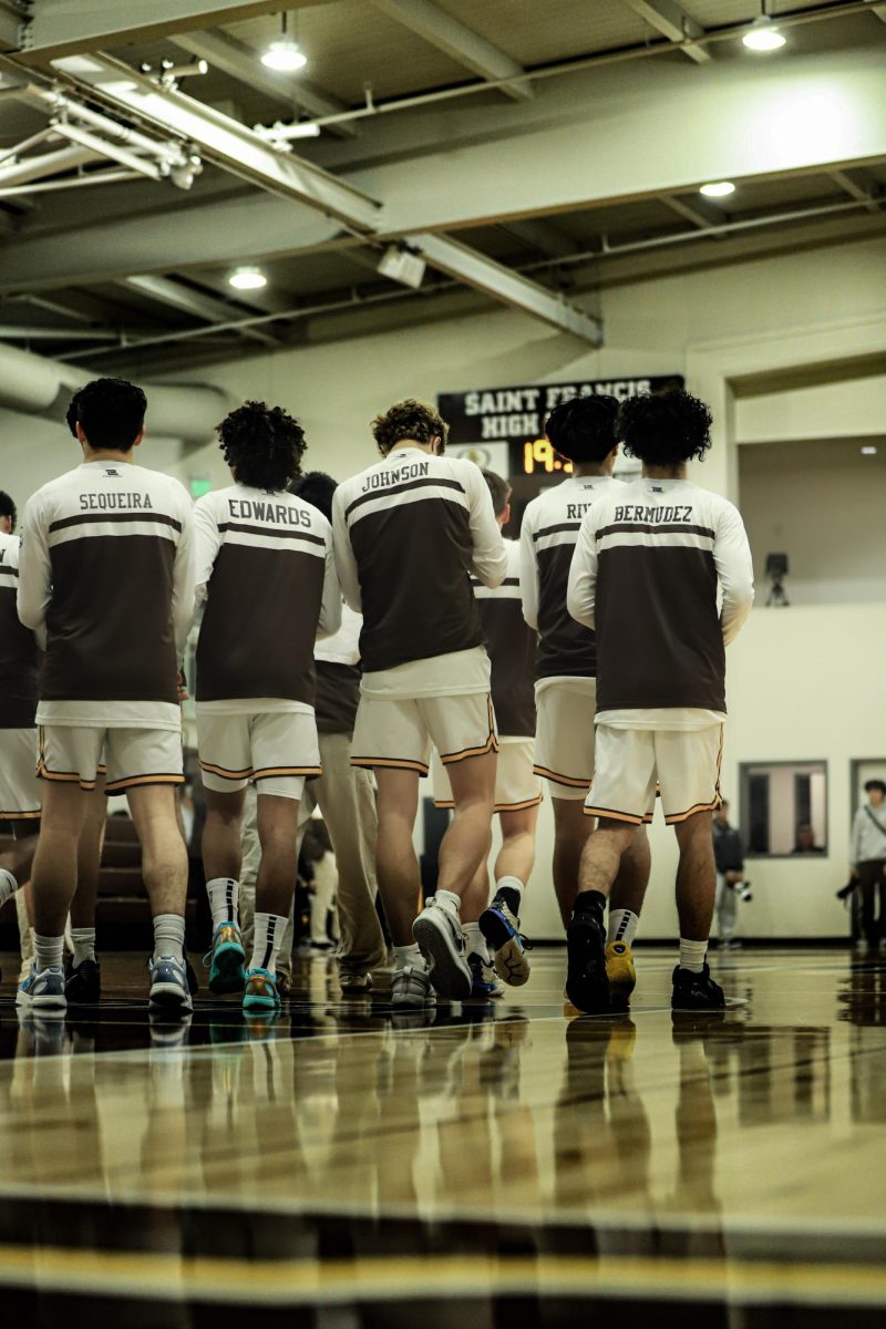 The team huddles up before the game starts.