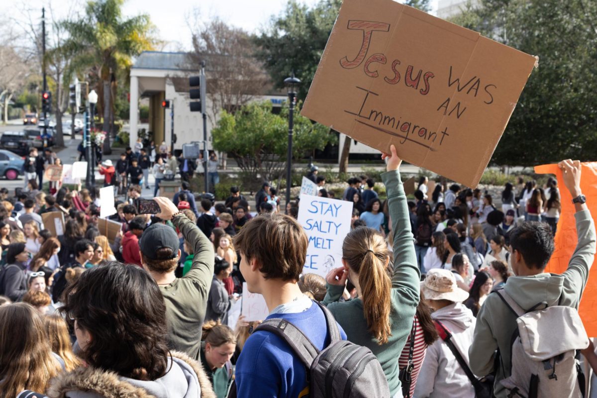 Students hold signs protesting ICE at Mountain View City Hall.