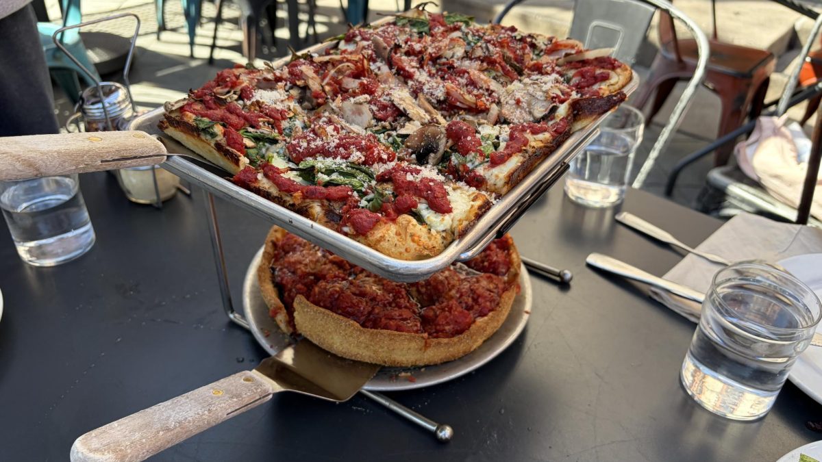 Blue Line, grandma style pizza atop Bees and the Bird, deep dish pizza.