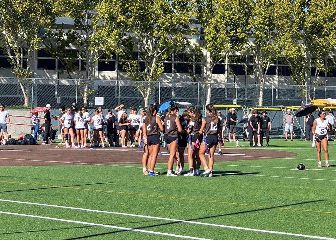 The Lancers in a team huddle during game against Mitty.